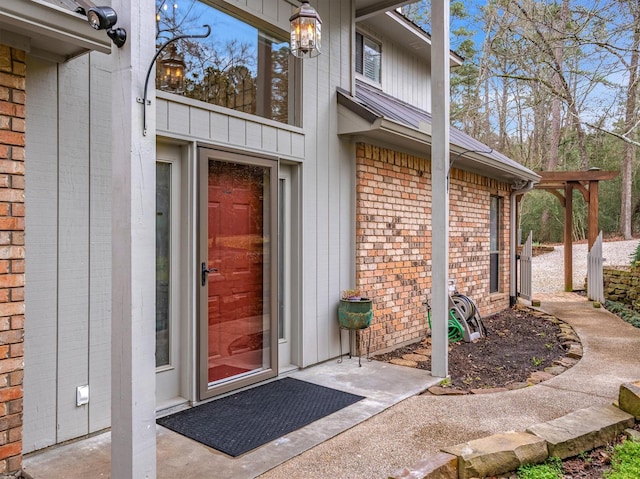 property entrance with brick siding