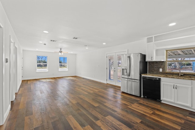 kitchen with dishwasher, a sink, white cabinetry, and stainless steel fridge with ice dispenser