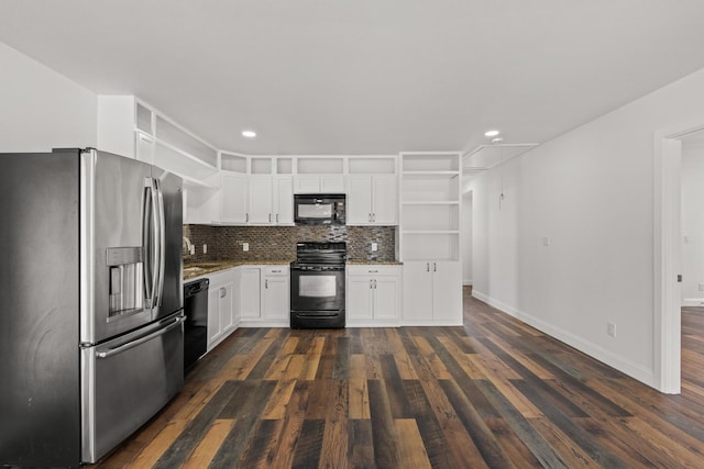 kitchen featuring tasteful backsplash, white cabinets, dark wood-style flooring, black appliances, and open shelves