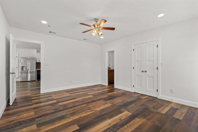 empty room with ceiling fan, recessed lighting, visible vents, baseboards, and dark wood finished floors