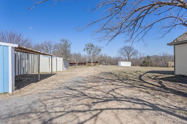 view of road featuring an outbuilding