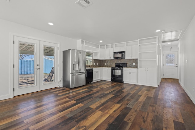 kitchen featuring french doors, open shelves, visible vents, dark wood-type flooring, and black appliances