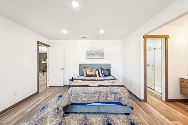 bedroom featuring recessed lighting, wood finished floors, visible vents, and baseboards