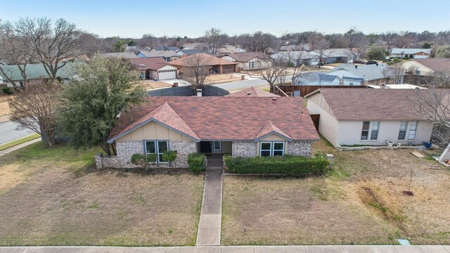 birds eye view of property with a residential view