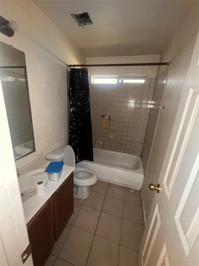 full bathroom featuring toilet, visible vents, vanity, tile patterned floors, and shower / bath combo