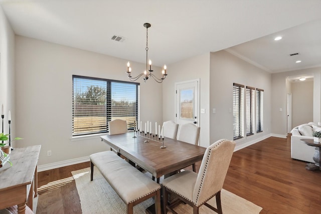 dining room with visible vents, baseboards, dark wood-style floors, an inviting chandelier, and recessed lighting