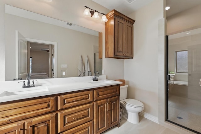 full bath featuring double vanity, visible vents, toilet, a sink, and a shower stall