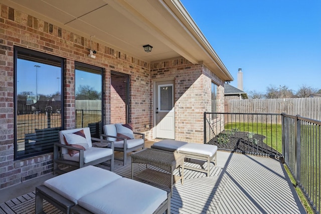 view of patio with fence and outdoor lounge area