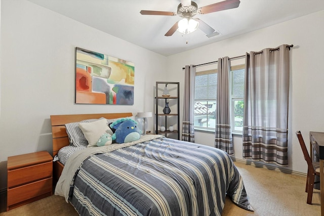 bedroom featuring carpet floors, visible vents, and a ceiling fan