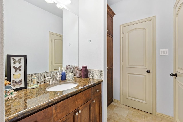 bathroom with decorative backsplash and vanity