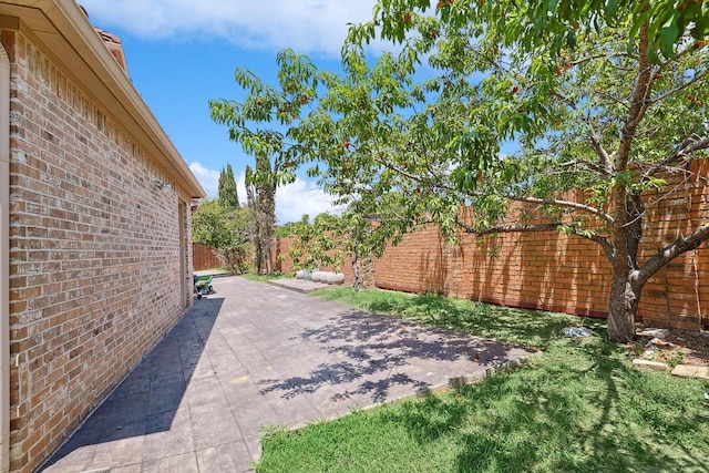 view of patio featuring fence