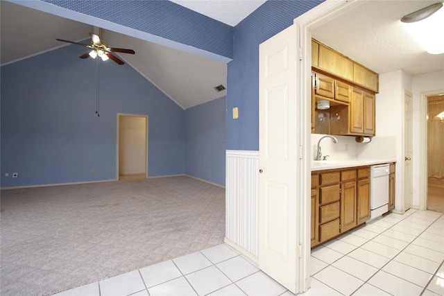 kitchen with light countertops, visible vents, light carpet, a sink, and dishwasher