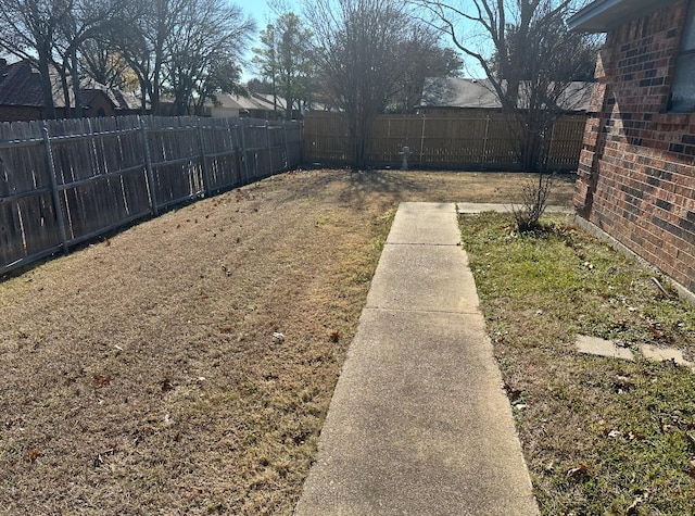 view of yard featuring a fenced backyard