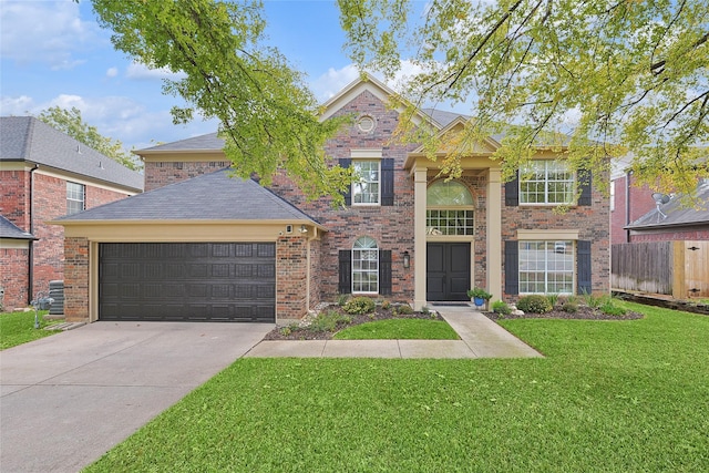 view of front of home with an attached garage, concrete driveway, brick siding, and a front yard