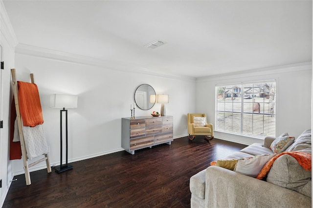 sitting room featuring ornamental molding, visible vents, baseboards, and wood finished floors