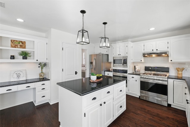 kitchen with stainless steel appliances, dark wood-type flooring, dark countertops, and under cabinet range hood