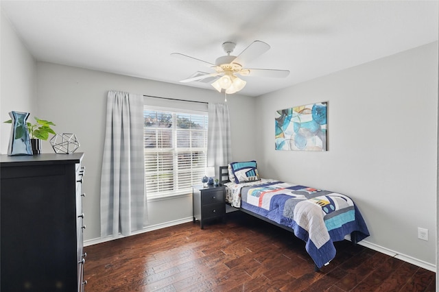 bedroom with ceiling fan, baseboards, and hardwood / wood-style floors