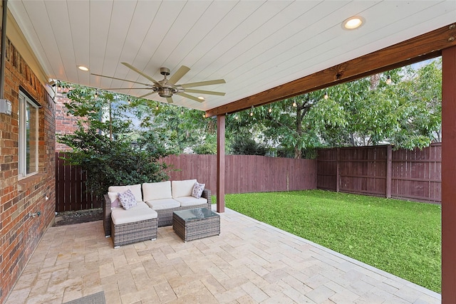 view of patio featuring ceiling fan, an outdoor hangout area, and a fenced backyard