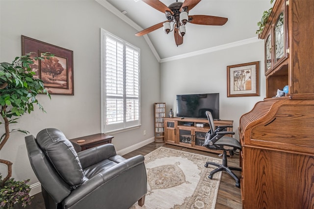 office area featuring wood finished floors, a ceiling fan, baseboards, vaulted ceiling, and ornamental molding