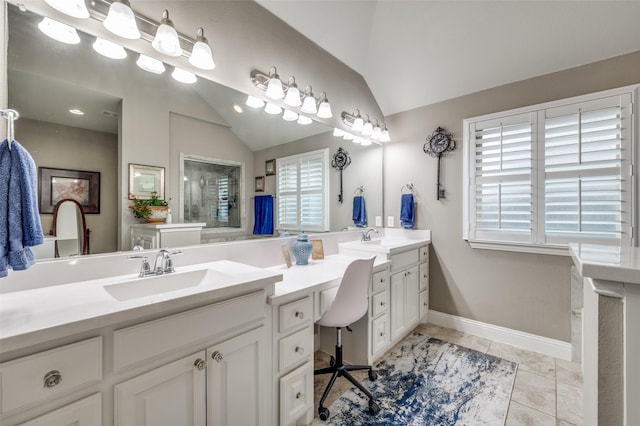 full bath featuring vaulted ceiling, a shower with door, a sink, and double vanity