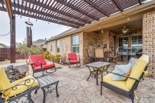 view of patio featuring ceiling fan, outdoor dining space, fence, and a pergola