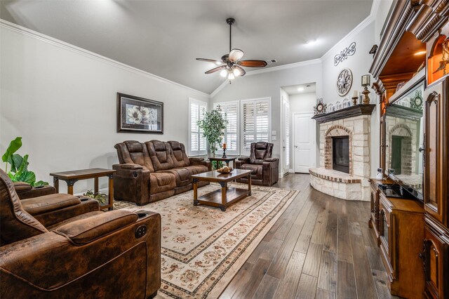 kitchen with arched walkways, a fireplace, a sink, vaulted ceiling, and stainless steel dishwasher