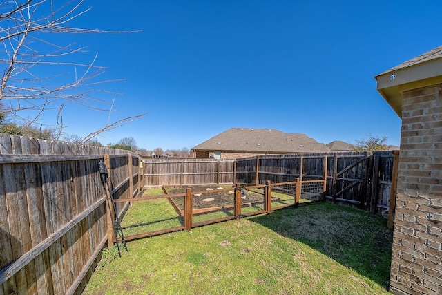 view of yard featuring a fenced backyard