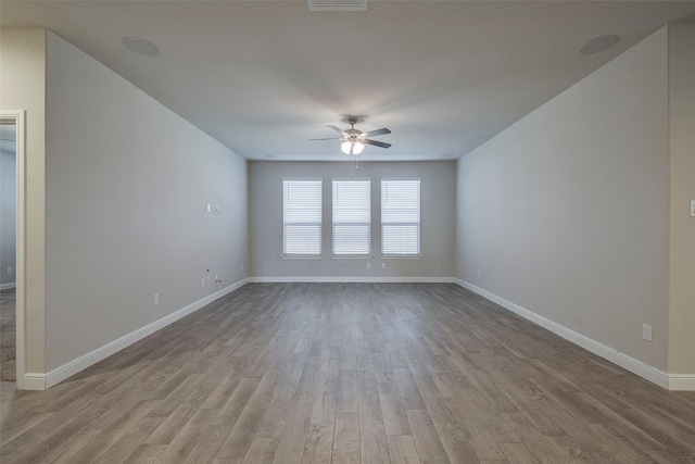 841 Holler Loop, Fort Worth, TX 76247 - empty room with ceiling fan, wood finished floors, and baseboards