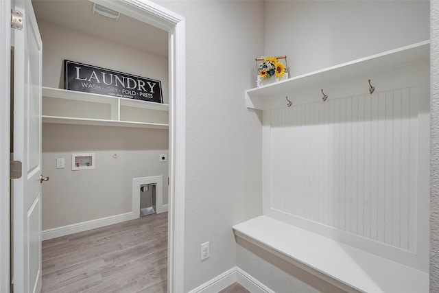 mudroom featuring wood finished floors and baseboards