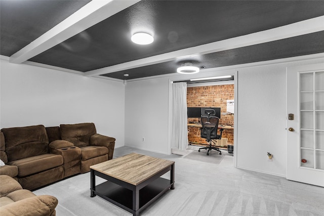 living room featuring brick wall, carpet flooring, beam ceiling, and baseboards