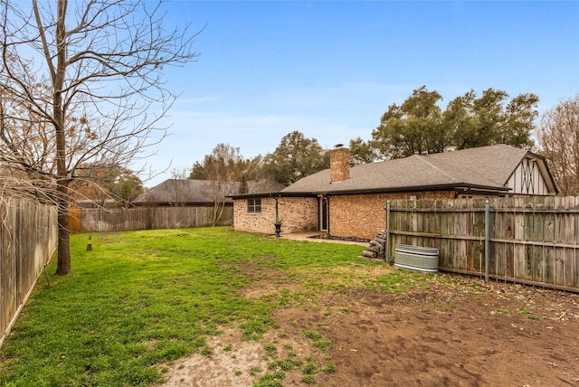 view of yard featuring a fenced backyard