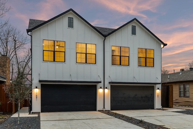 view of front of home featuring concrete driveway, a garage, and board and batten siding