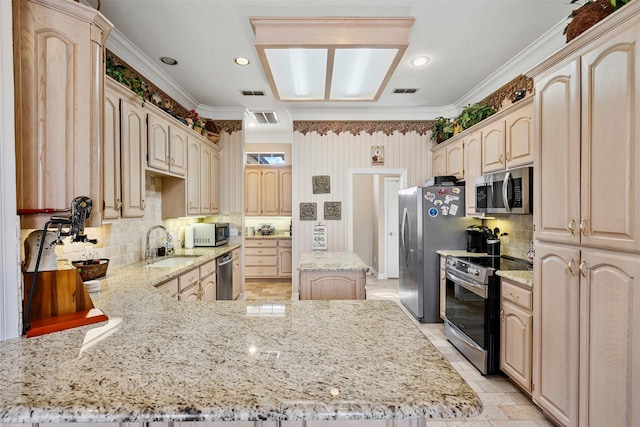 kitchen featuring stainless steel appliances, a peninsula, visible vents, light stone countertops, and light brown cabinetry