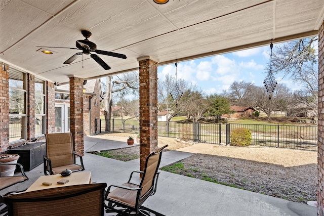 view of patio / terrace featuring a ceiling fan and fence