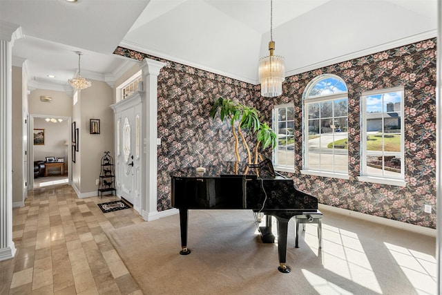 sitting room featuring wallpapered walls, decorative columns, baseboards, ornamental molding, and vaulted ceiling