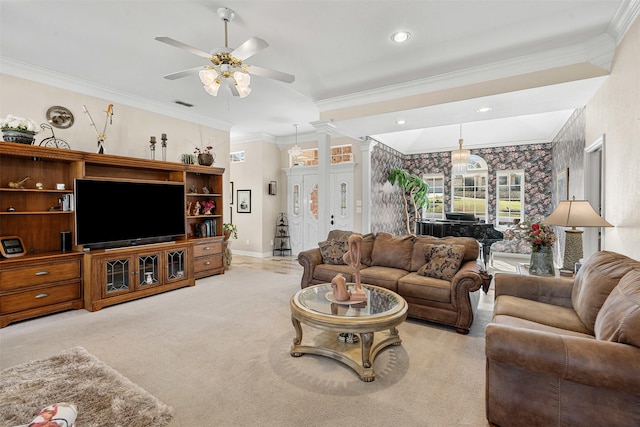 living area with carpet floors, a ceiling fan, baseboards, ornamental molding, and ornate columns