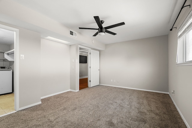 unfurnished bedroom featuring visible vents, baseboards, ceiling fan, washer / clothes dryer, and carpet floors