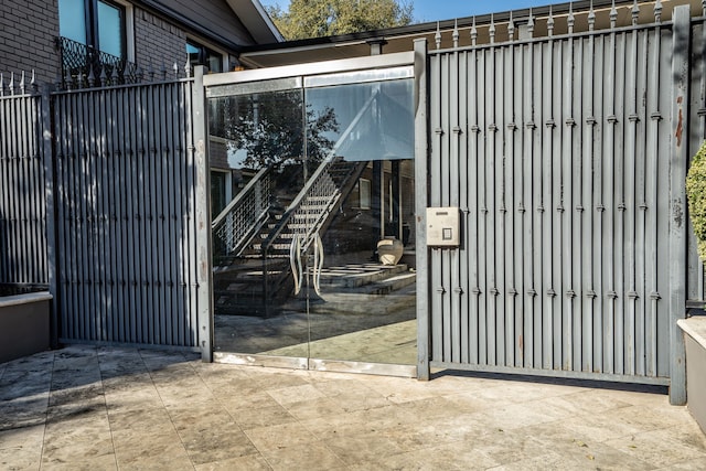 view of gate with fence