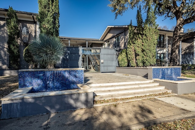 view of front of property with stairs