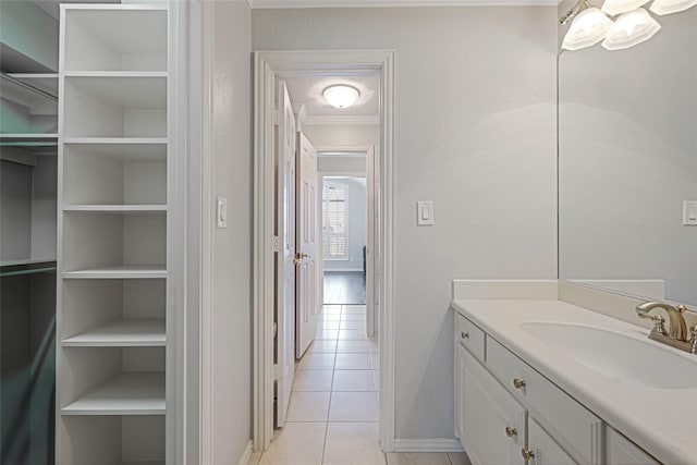 bathroom featuring ornamental molding, vanity, built in features, and tile patterned floors