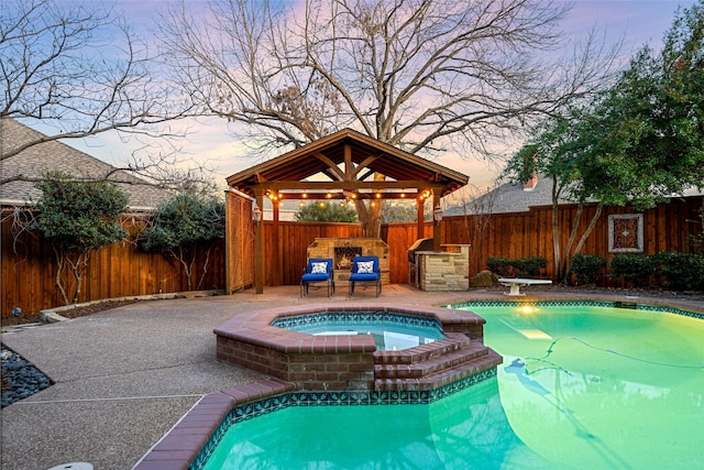 view of pool featuring a patio area, a fenced backyard, a diving board, and a gazebo