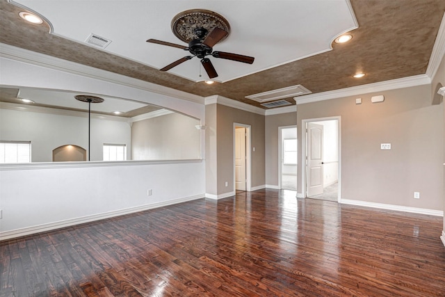 spare room with baseboards, visible vents, wood finished floors, crown molding, and recessed lighting