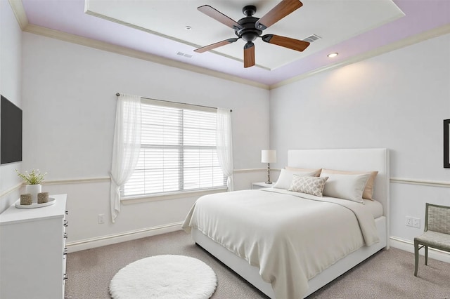 carpeted bedroom with visible vents, ornamental molding, and baseboards