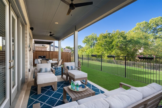 view of patio with outdoor dining space, a fenced backyard, an outdoor living space, and a ceiling fan