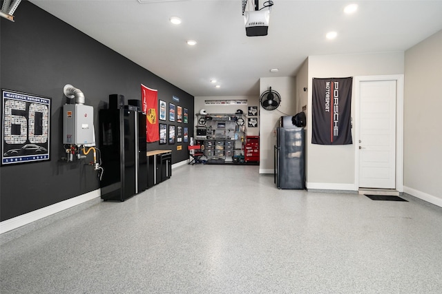 garage featuring water heater, baseboards, a garage door opener, and recessed lighting