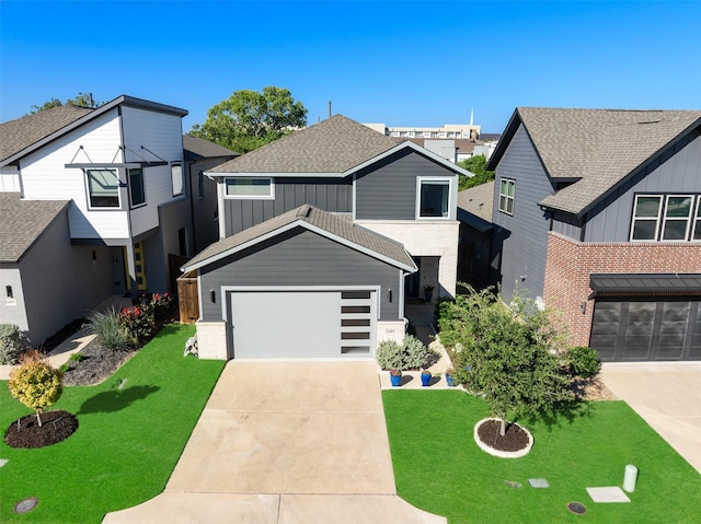 view of front of property featuring a shingled roof, board and batten siding, a garage, a residential view, and driveway