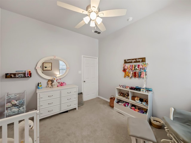 bedroom featuring visible vents, ceiling fan, and light carpet