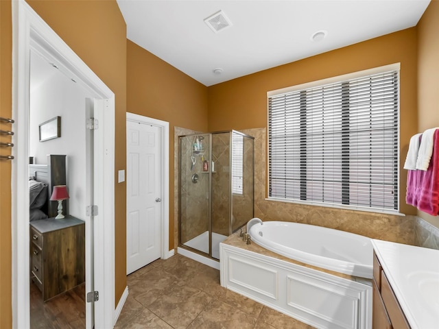 bathroom featuring a garden tub, visible vents, a stall shower, vanity, and tile patterned floors