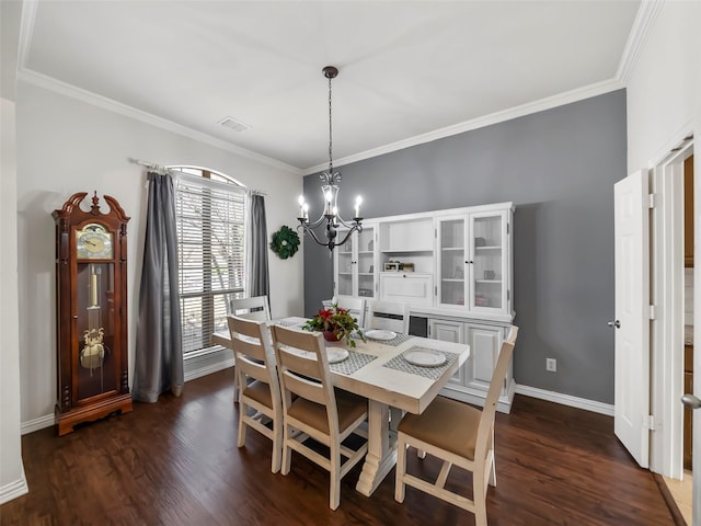 dining area with a notable chandelier, crown molding, baseboards, and dark wood-style flooring