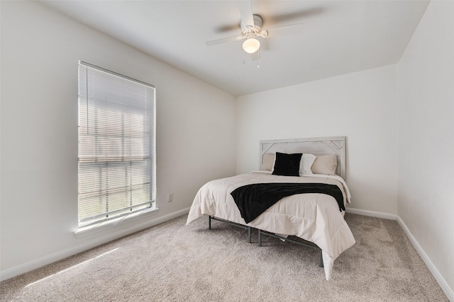 bedroom featuring carpet, baseboards, and ceiling fan